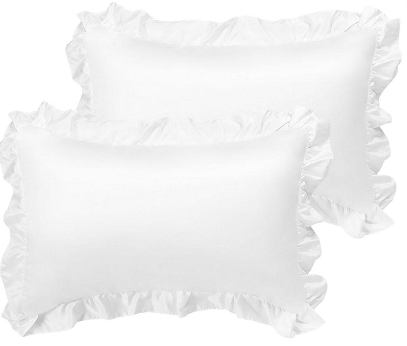 White ruffled pillow shams